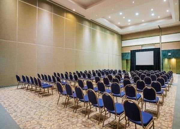 Laguna 1 event room, with chairs and projector at Park Royal Grand Cancun