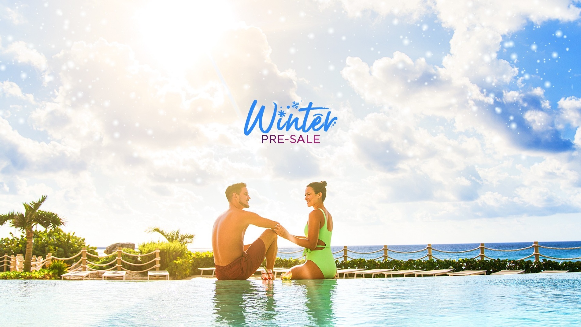 a man and woman are sitting in a swimming pool with the words winter pre-sale above them