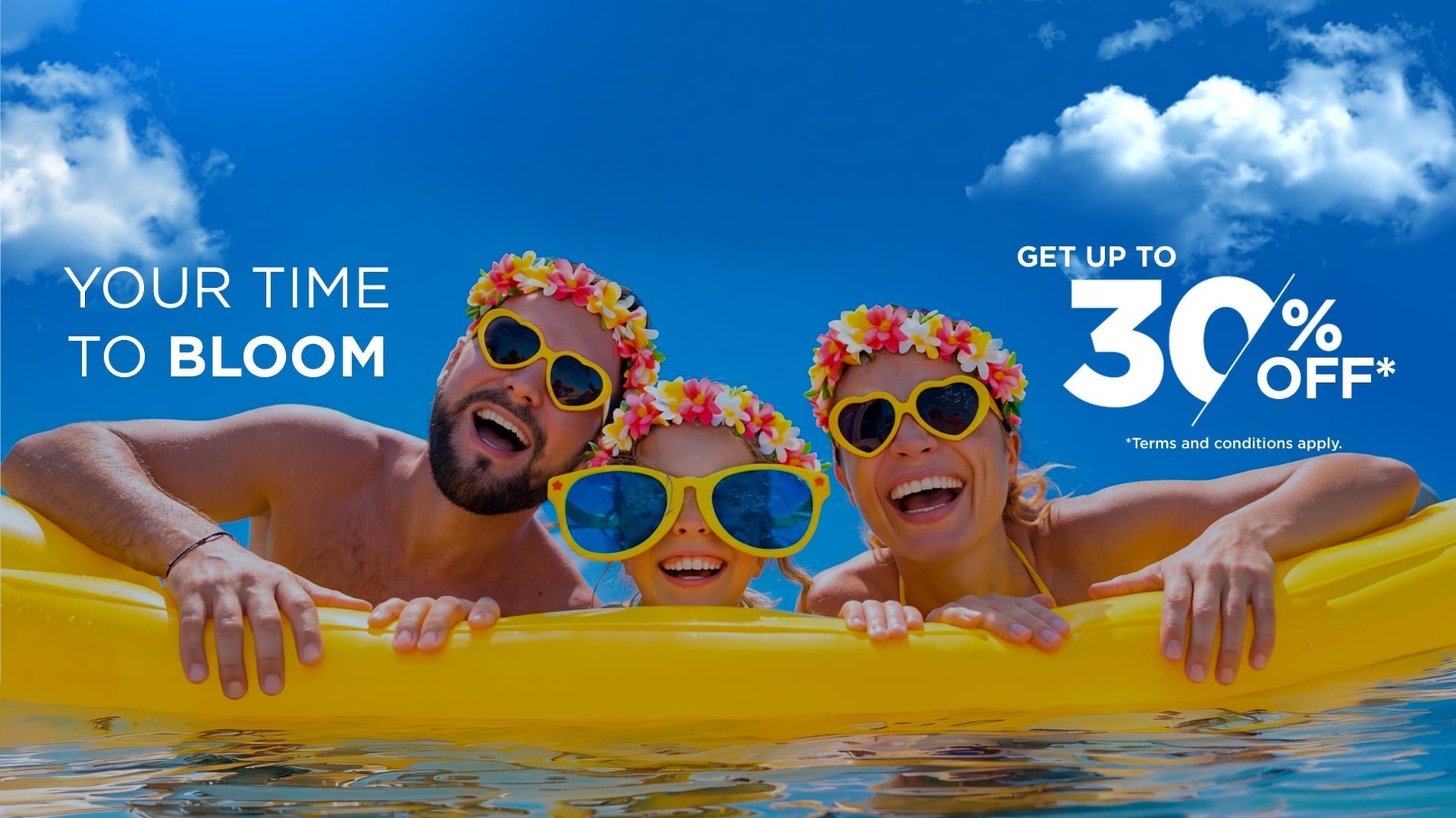 A vibrant advertisement features a smiling family wearing flower crowns and yellow sunglasses under a blue sky, promoting a deal with "YOUR TIME TO BLOOM," up to 30% off, and a free shuttle.