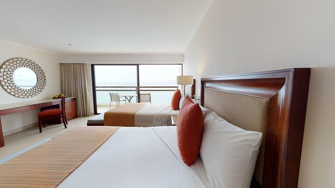 Large room with two beds and sea views at the Hotel Grand Park Royal Puerto Vallarta