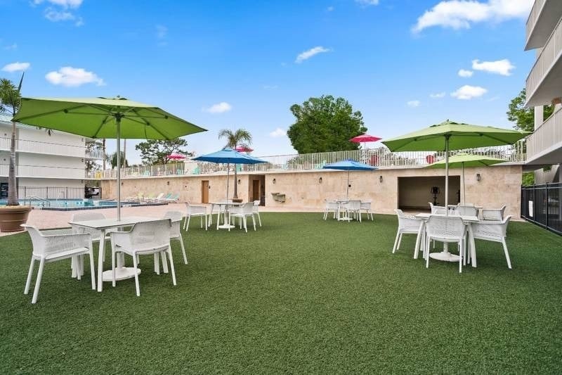 Lawn area with tables and chairs in Royal Park Orlando, Florida