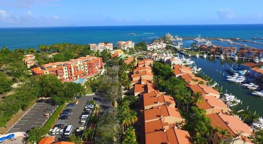 an aerial view of a marina with boats in it