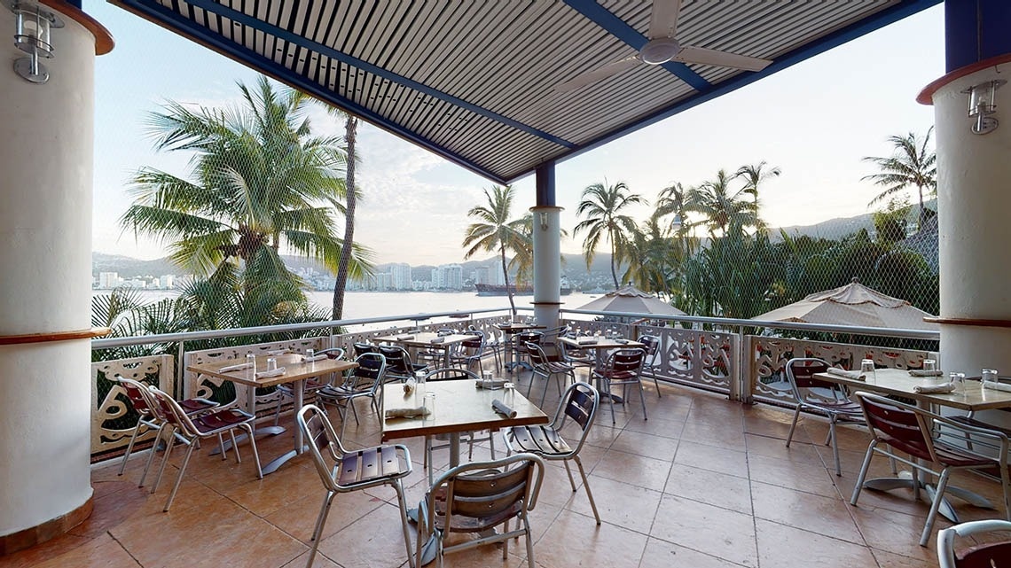 Terrace of the El Pescador restaurant with views of the Pacific Ocean at the Park Royal Beach Acapulco Hotel