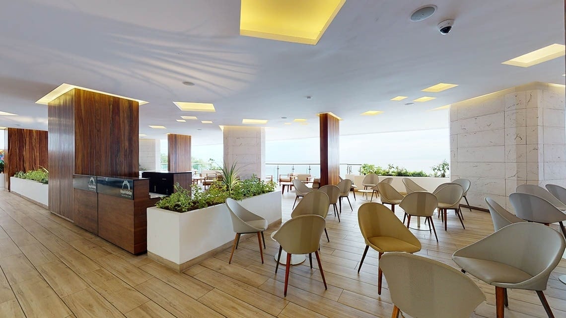 Area of tables and chairs with sea views at Hotel Grand Park Royal Puerto Vallarta