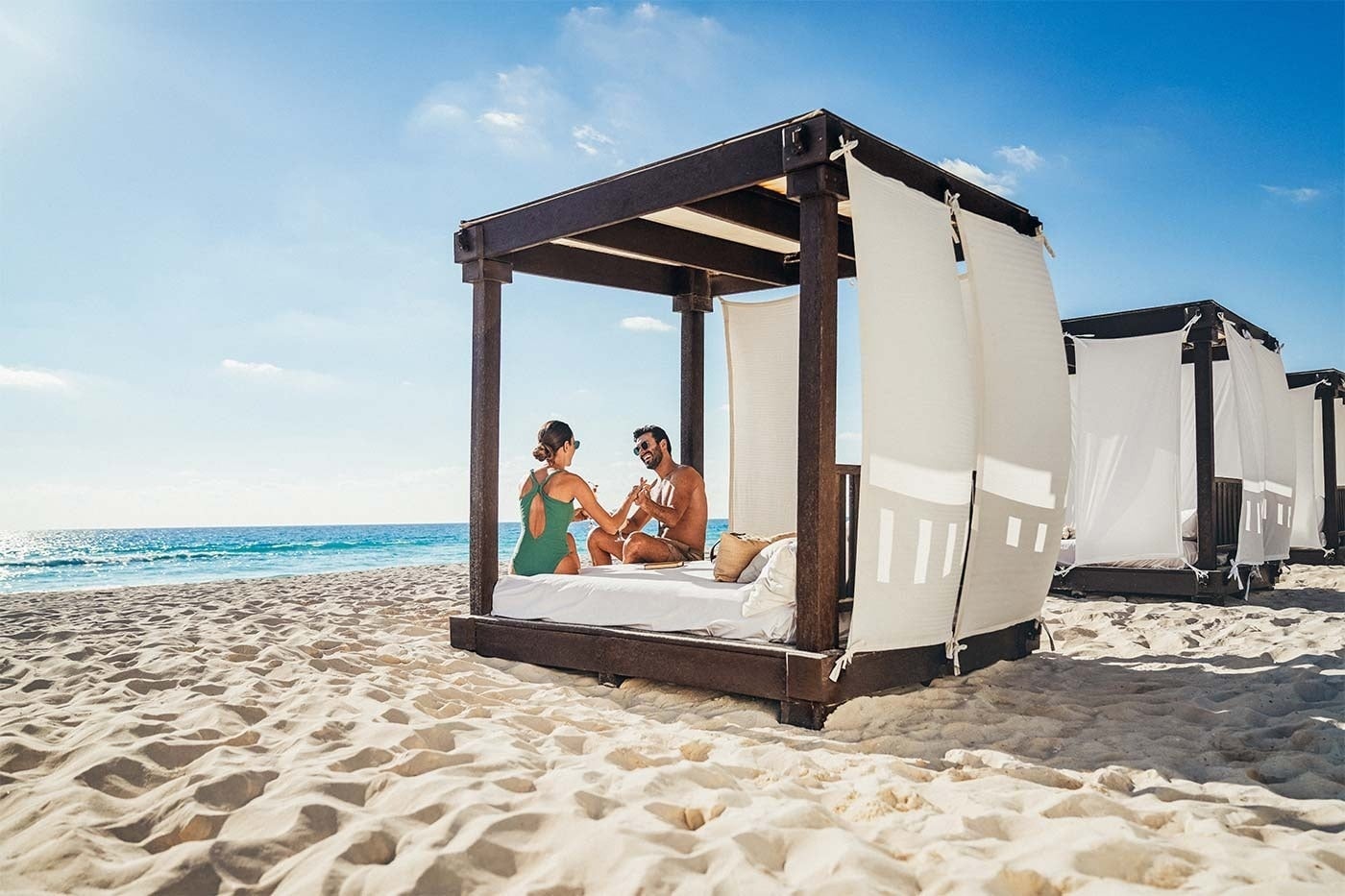 Hotel Grand Park Royal Cancun: Couple enjoys a cabana on the beach, Mexican Caribbean.