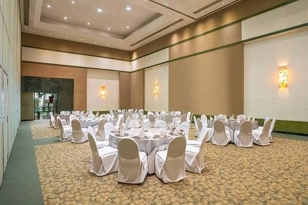 Laguna Lounge with various tables and chairs at Park Royal Grand Cancun