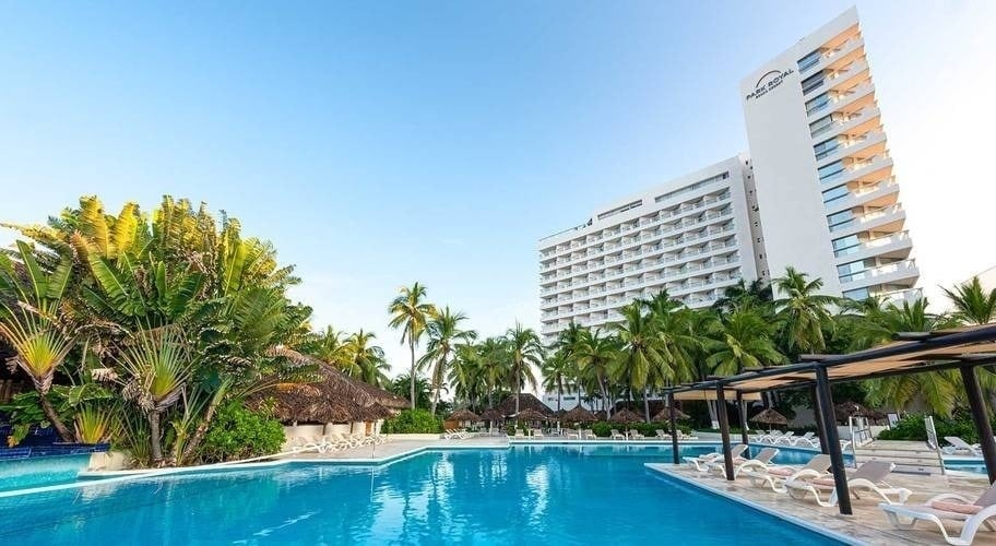 Overview of the outdoor pools and facilities of the Grand Park Royal Beach Ixtapa Hotel