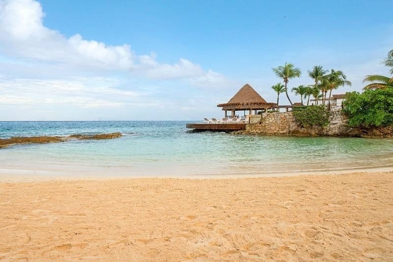 Private beach with golden sand and crystal clear water of the Hotel Grand Park Royal Cozumel in Mexico