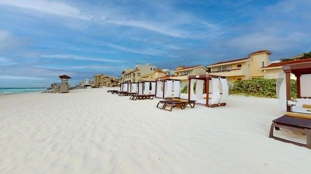 Balinese beds on the beach at The Villas by Grand Park Royal Cancun