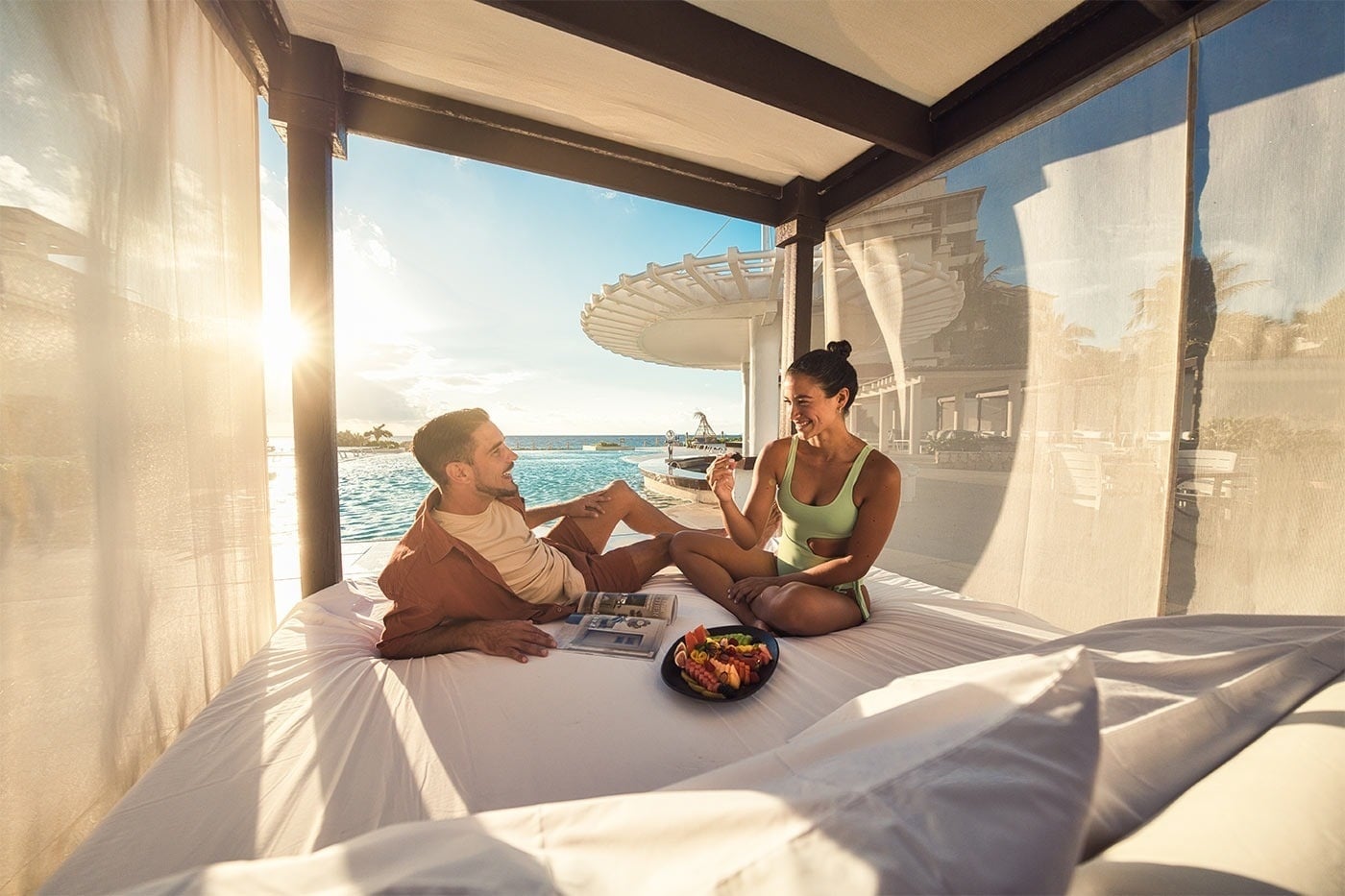 Hotel Grand Park Royal Cancun | Romantic cabana, couple enjoying fruit & sun. Mexican Caribbean.