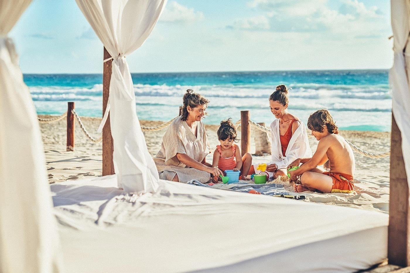 Family playing on beach at Hotel Grand Park Royal Cancun | Official Web