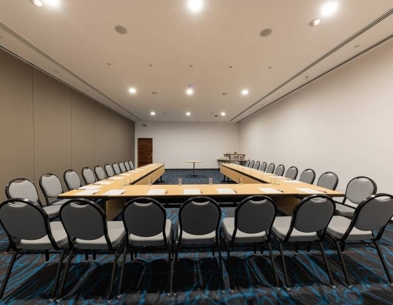 Function room with large U-shaped bench and chairs at Park Royal hotels and resorts