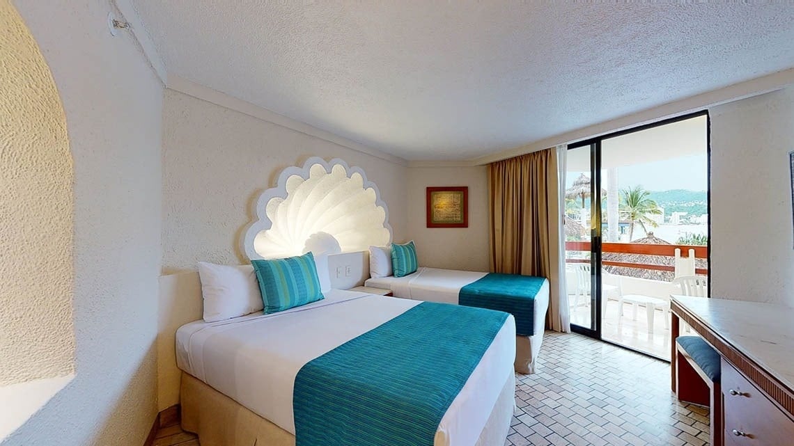 Deluxe Ocean View Room with two beds and terrace overlooking the Pacific Ocean at the Park Royal Beach Acapulco Hotel