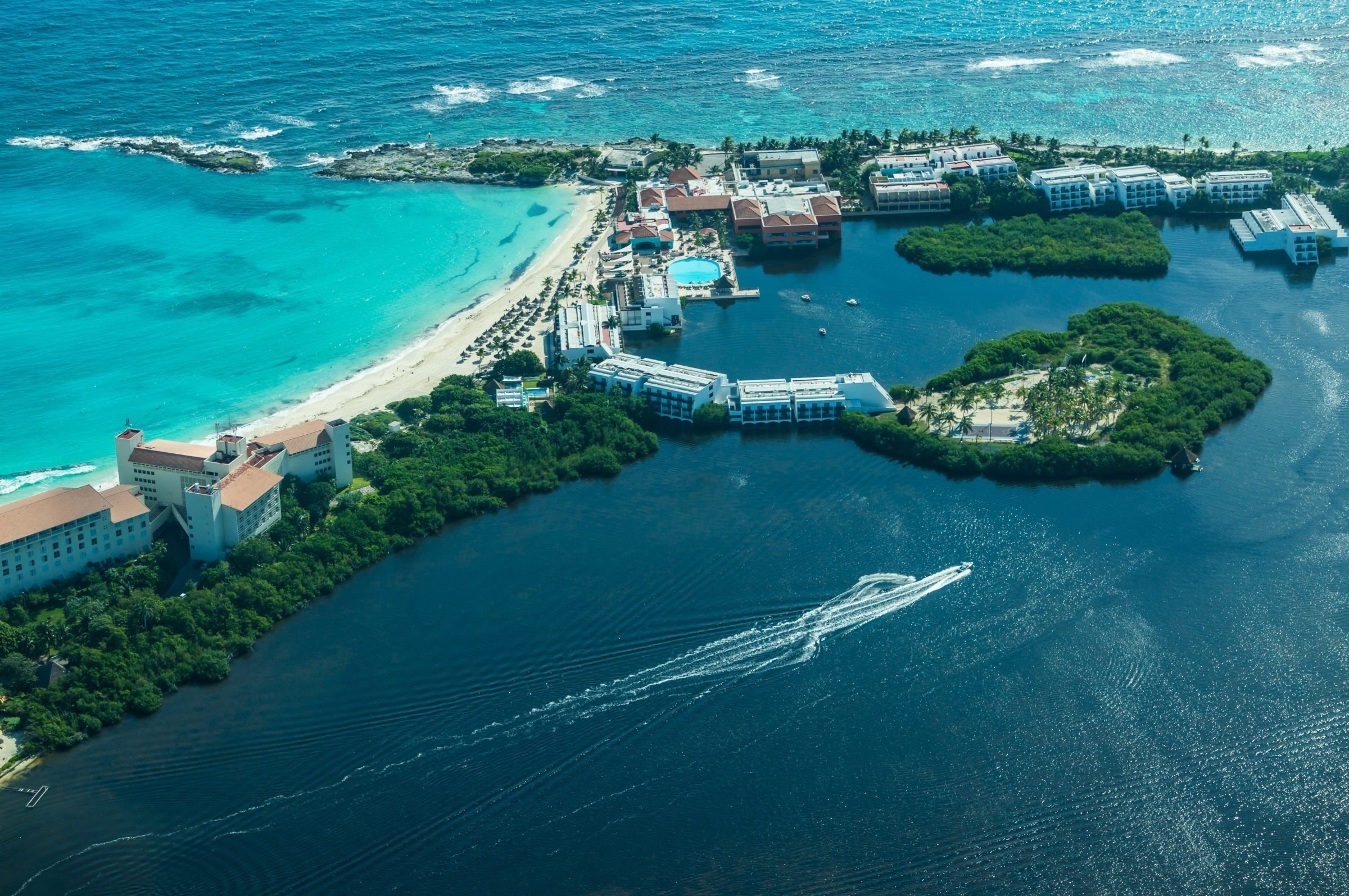 an aerial view of a large body of water with a small island in the middle