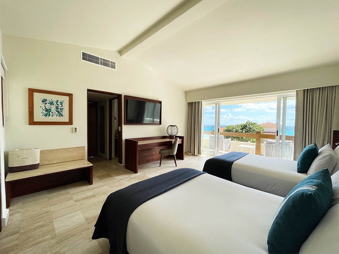 Quarto com camas de casal separadas no The Villas by Grand Park Royal Cancun