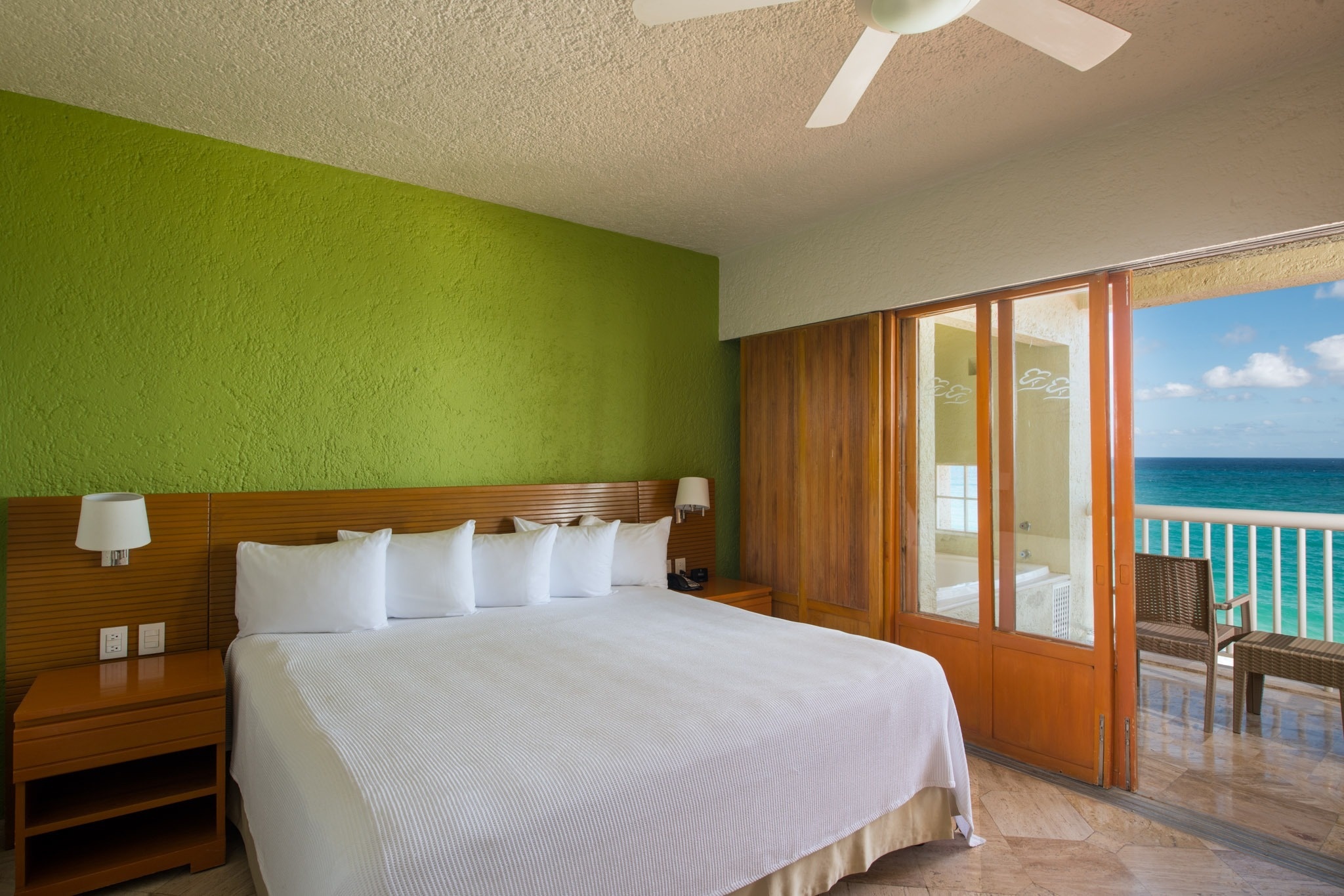 King hotel room with balcony overlooking the sea at Park Royal: Club Regina Cancun.