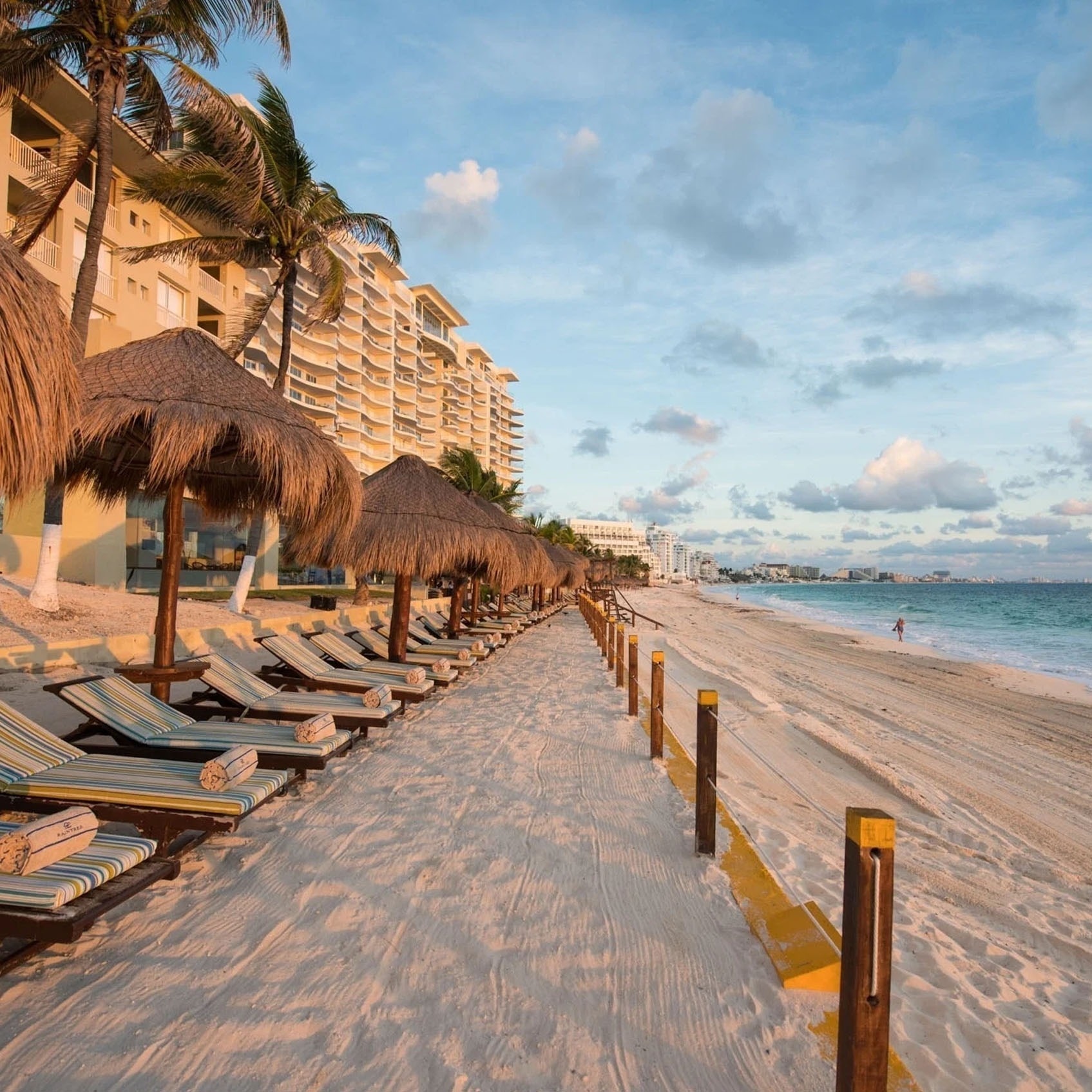Lounge chairs and palapas at Park Royal: Club Regina Cancun. Perfect for vacation