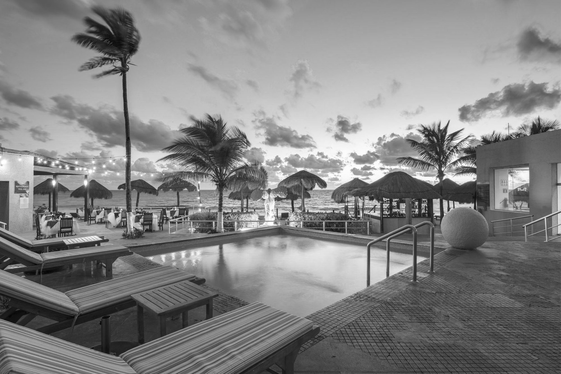 Park Royal: Club Regina Cancun: Beachside pool at sunset with palm trees.=s1900