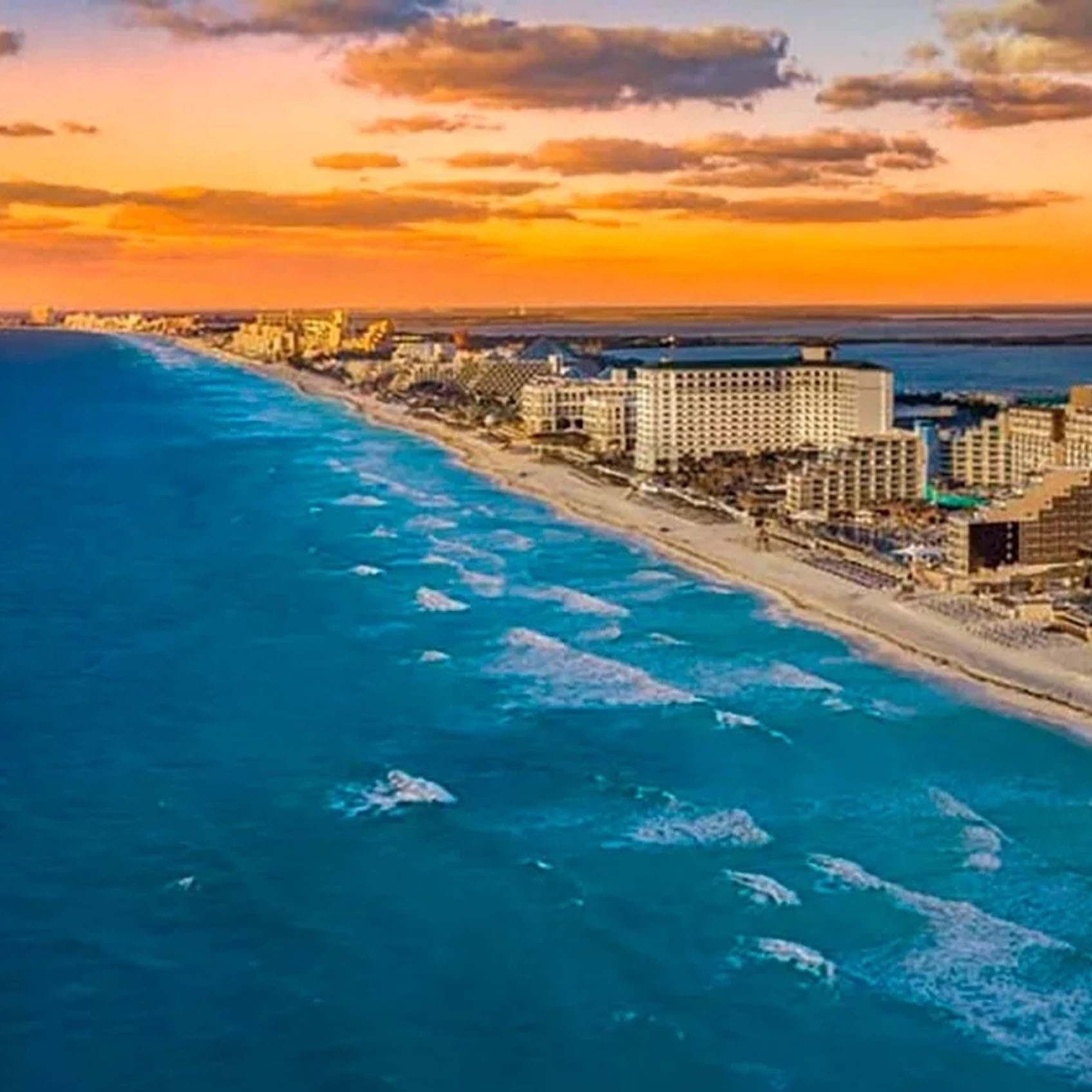 Park Royal: Club Regina Cancun: aerial view of beach and ocean at sunset.