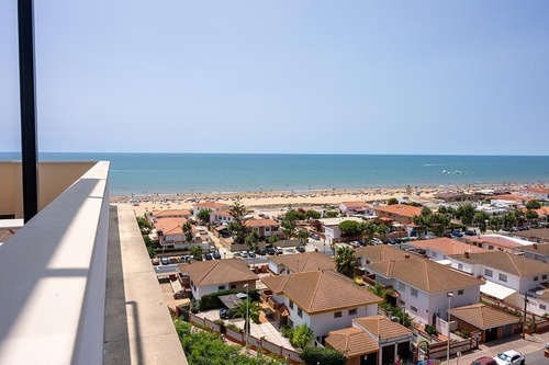Panoramic sea, sandy beach, and town view from Hotel Pato Amarillo, a 4-star hotel in Punta Umbría (Huelva).