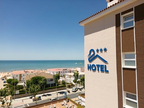 Pato Rojo Hotel in Punta Umbria, Huelva, ocean view with beach and blue sky from hotel.