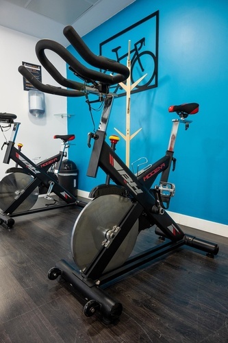 Modern spin bikes in the Pato Rojo Hotel fitness center, perfect for a workout in Punta Umbria.