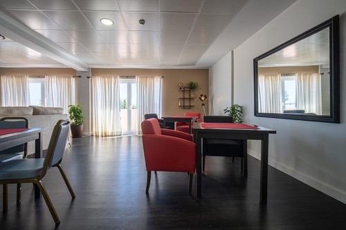 Pato Rojo Hotel in Punta Umbria offers a bright, modern lounge with comfortable seating and natural light.