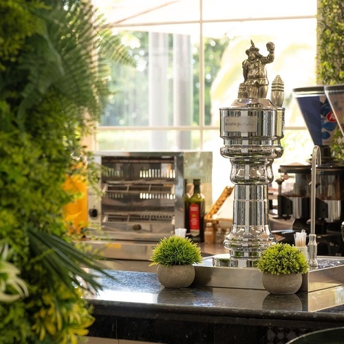 Hotel Pato Amarillo, 4-star hotel in Punta Umbría, Huelva. Bright breakfast buffet with a stylish chrome dispenser.