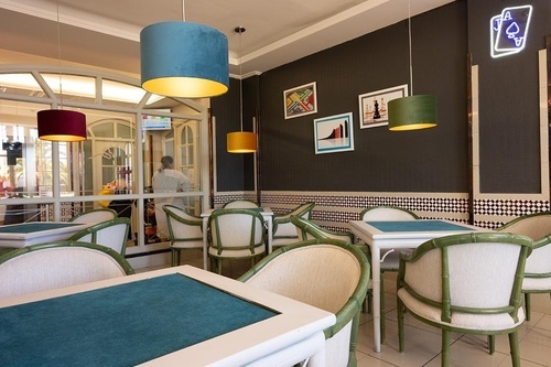 Hotel Pato Amarillo, 4-star hotel in Punta Umbría, Huelva: Game room with green tables, card decor.