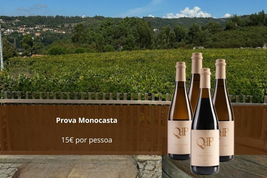 three bottles of prova monocasta sit on a barrel in front of a vineyard