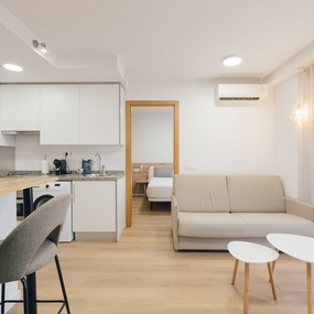 a living room with a couch and two tables