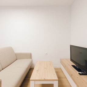 a living room with a couch and a flat screen tv