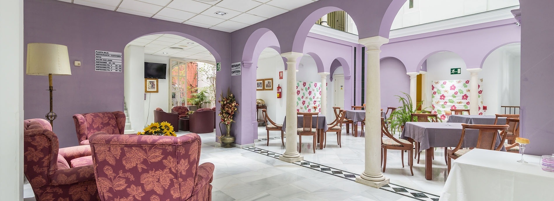 a hotel room with two beds and a nightstand