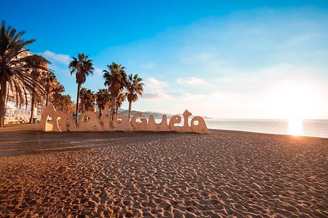 a sign on a beach that says " marbella "