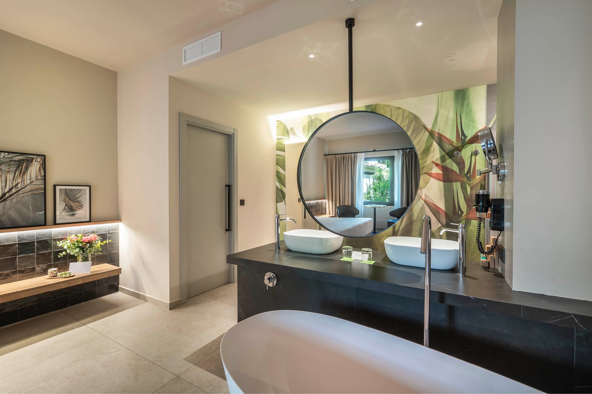 a bathroom with two sinks and a large mirror