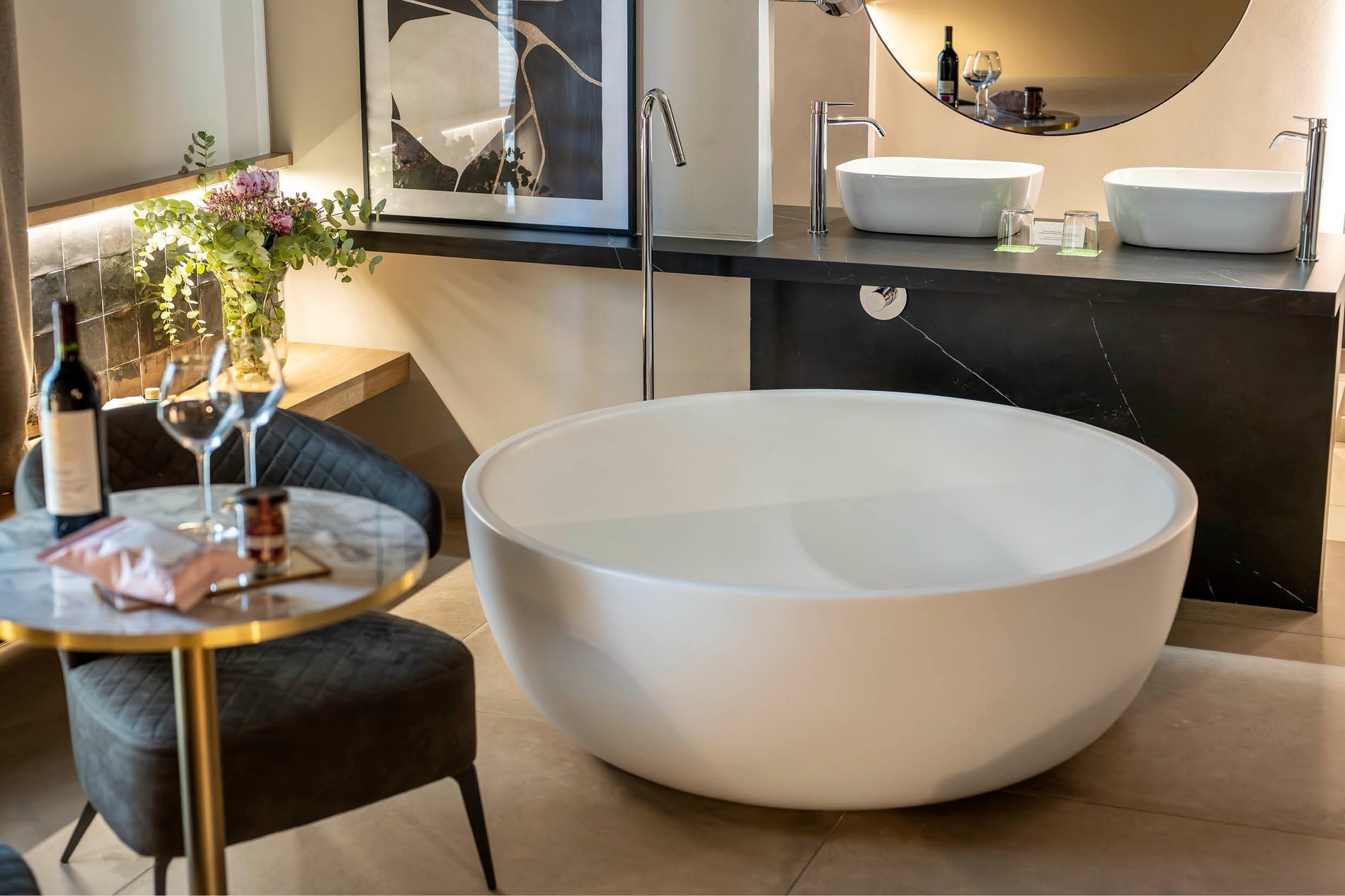 a bathroom with a bathtub and two sinks