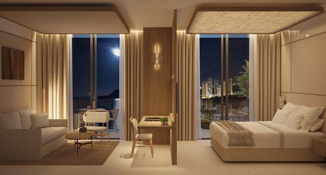 una habitación de hotel con una cama y un escritorio