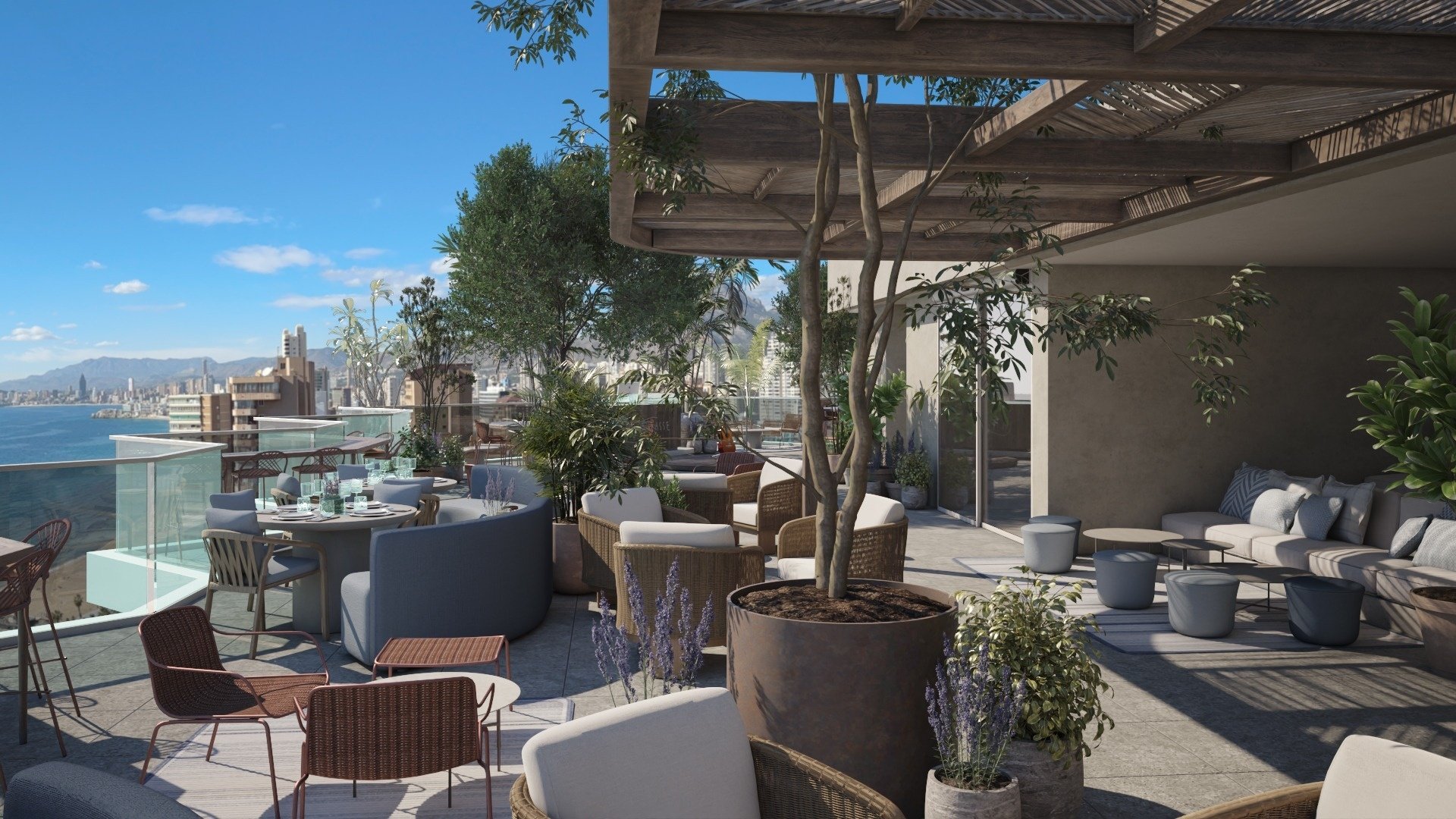 una terraza llena de muebles y plantas con vistas al océano