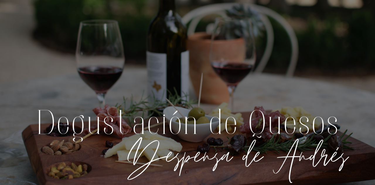 a bottle of wine sits on a cutting board next to two glasses of wine