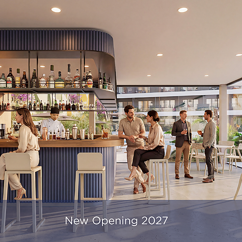 Stylish bar and lounge area at a hotel with guests enjoying drinks, perfect for Port Hotels: Corporativa.