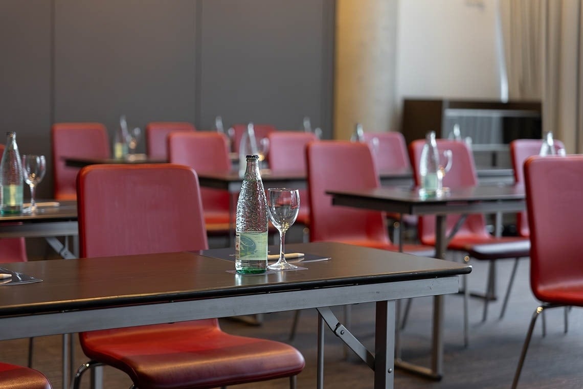 a bottle of aquafina water sits on a table