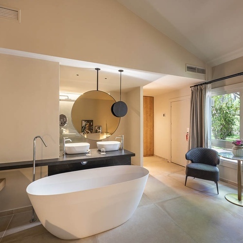 a bathroom with two sinks and a bathtub