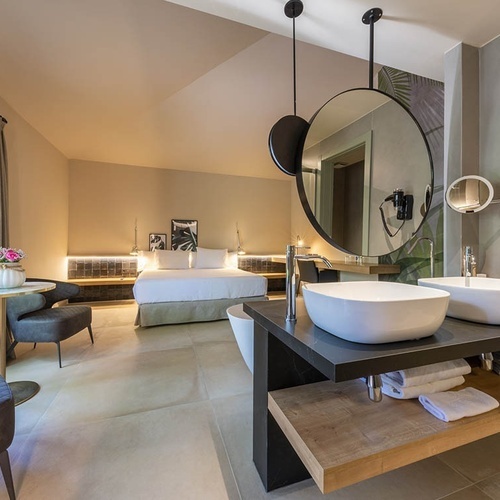 a bathroom with two sinks and a large mirror