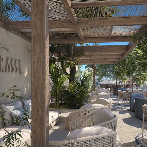 un patio con muebles y un letrero que dice la terrasse