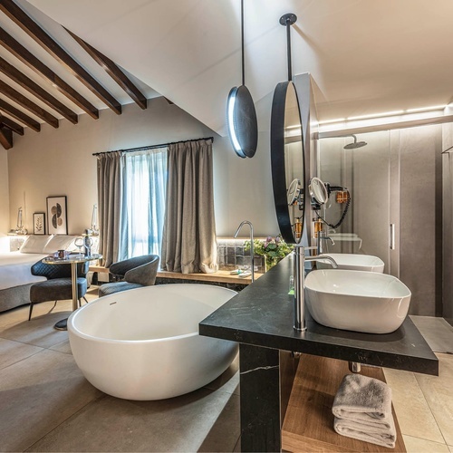 a bathroom with two sinks and a bathtub