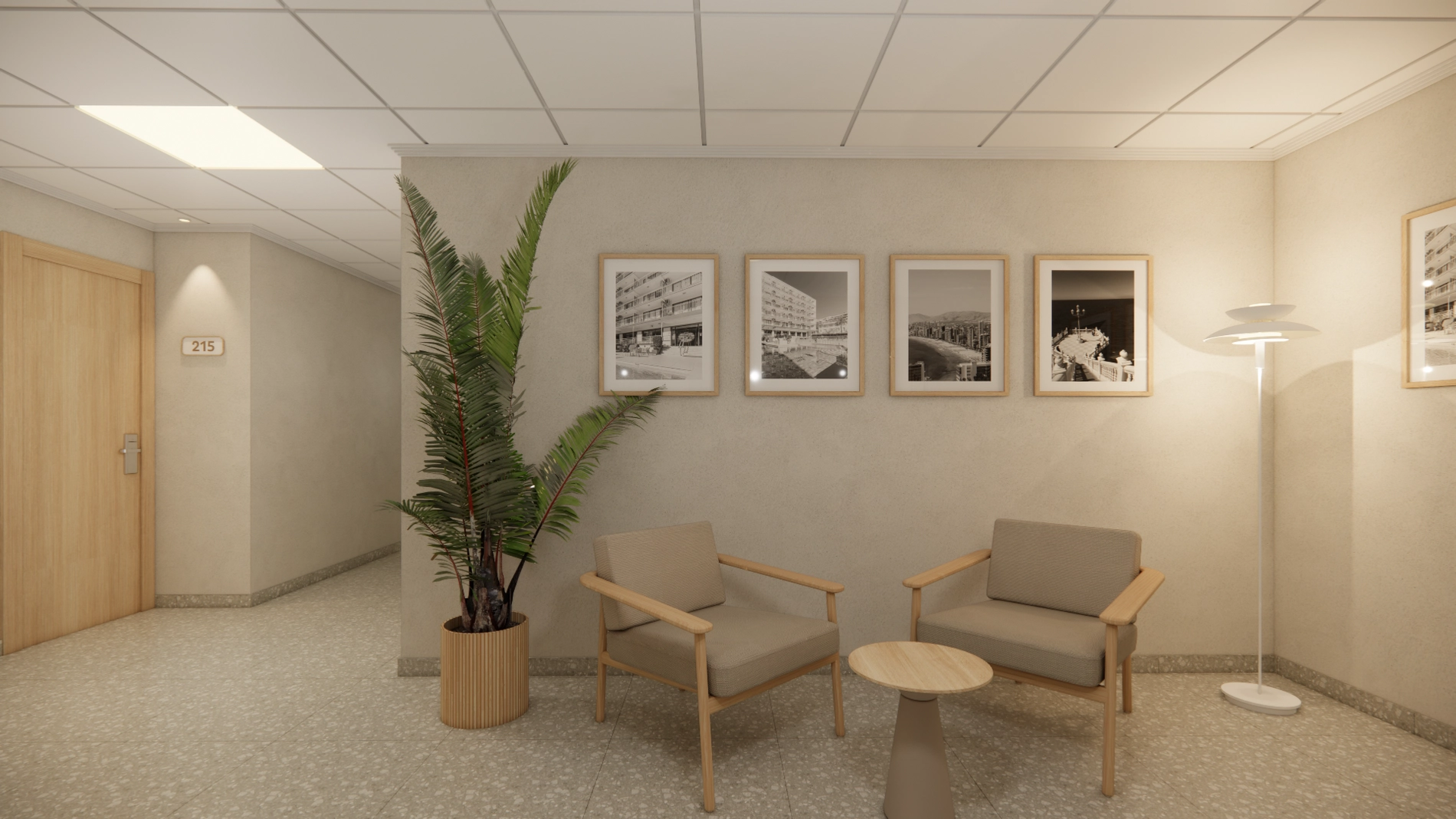 Sala de espera de hotel con sillas, mesa y planta, mostrando la entrada Port Hotels.