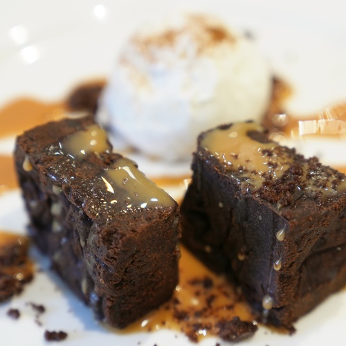 a white plate topped with brownies and ice cream