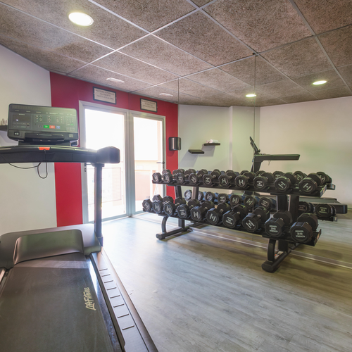 a treadmill in a gym that says life fitness