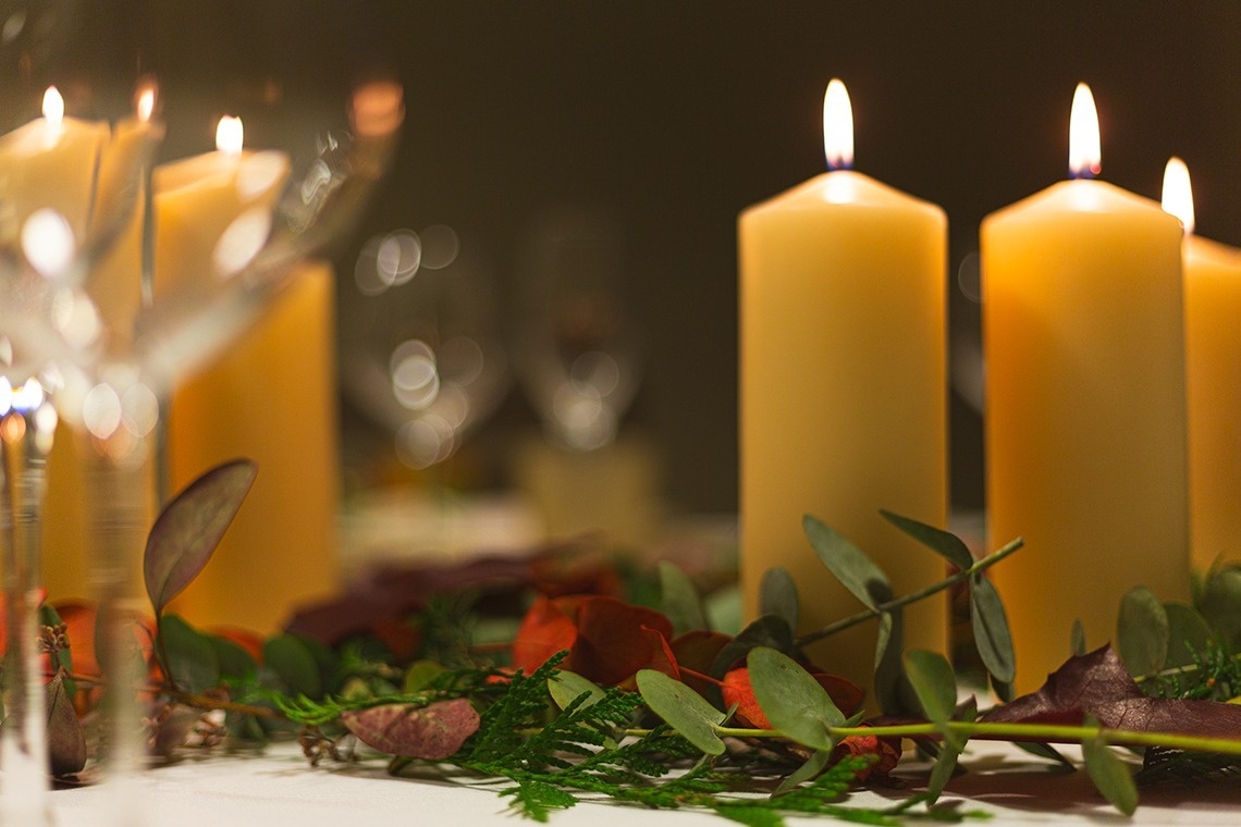 a table with candles and flowers on it