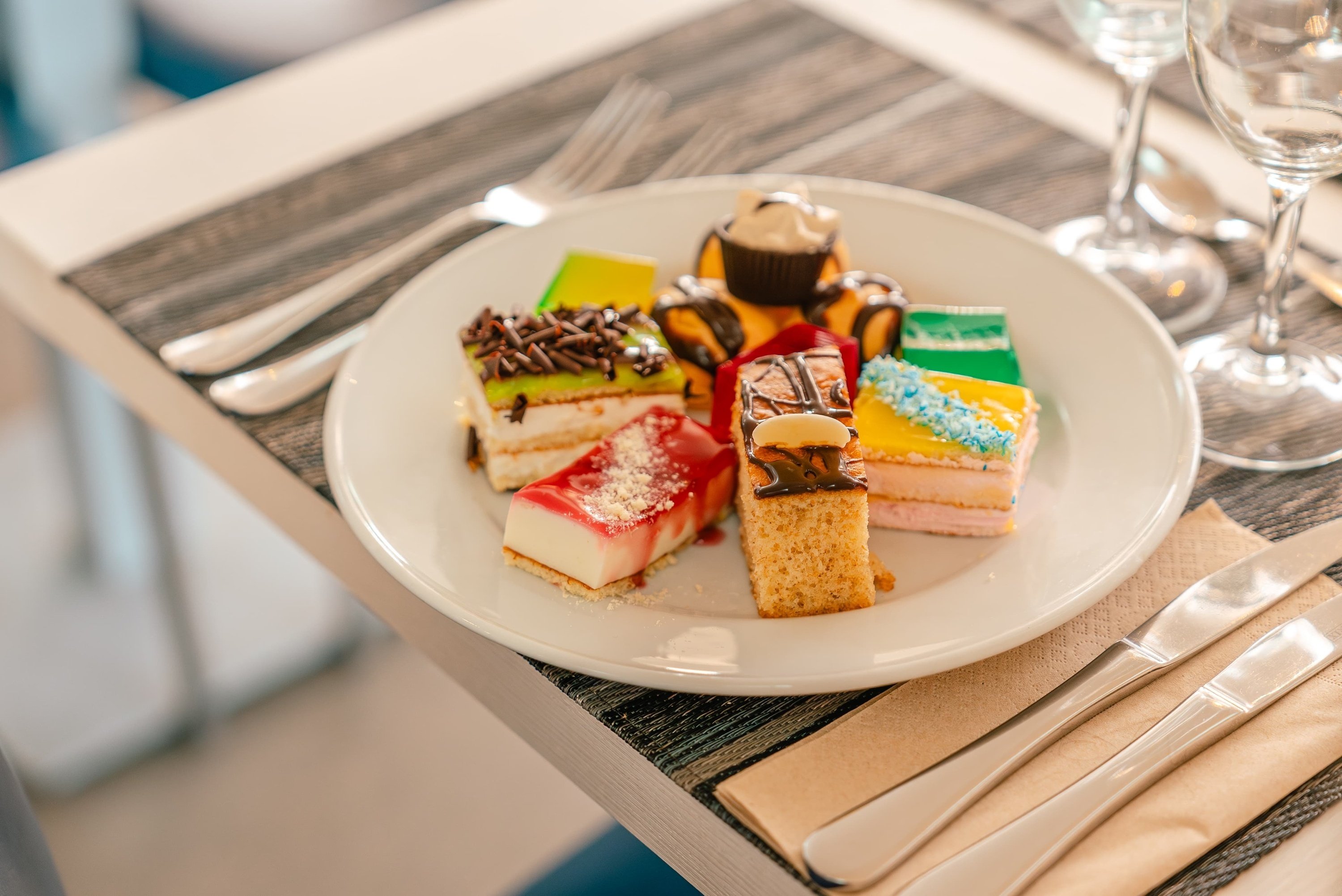 a white plate with a variety of desserts on it